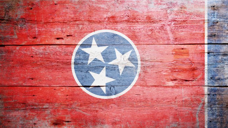 Tennessee state flag on wood