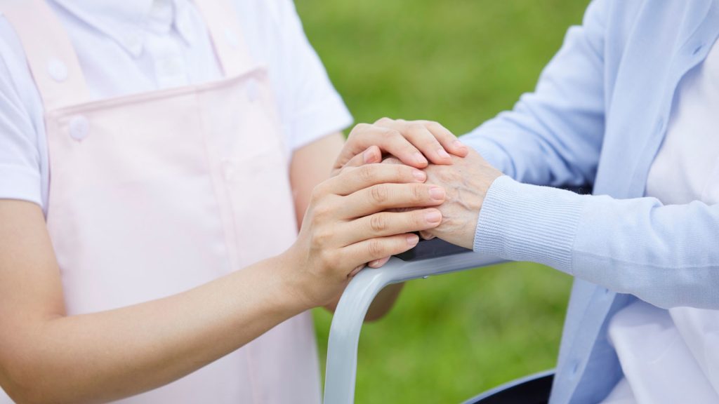 Elderly Woman with Caregiver