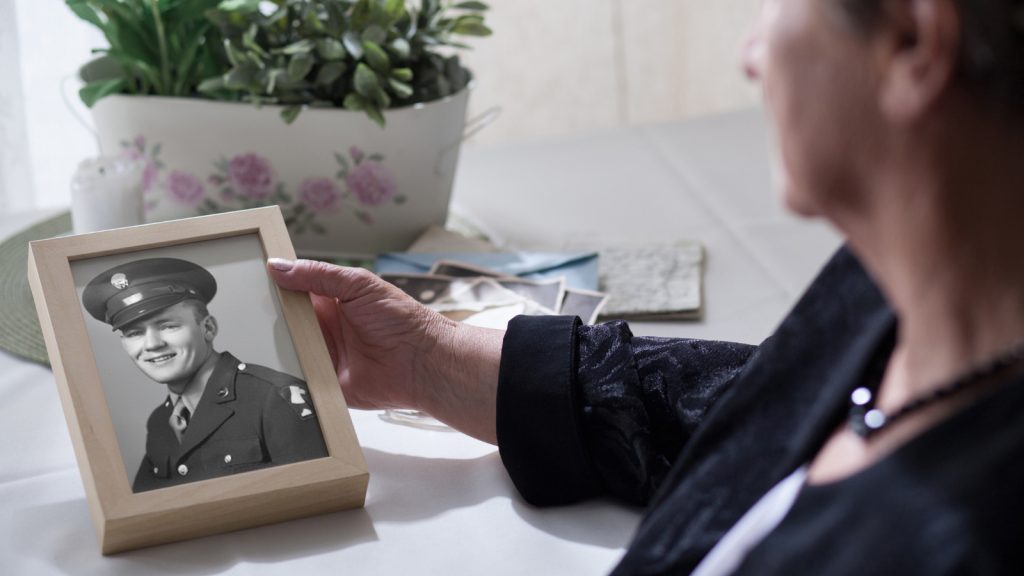 Widow with veteran photo