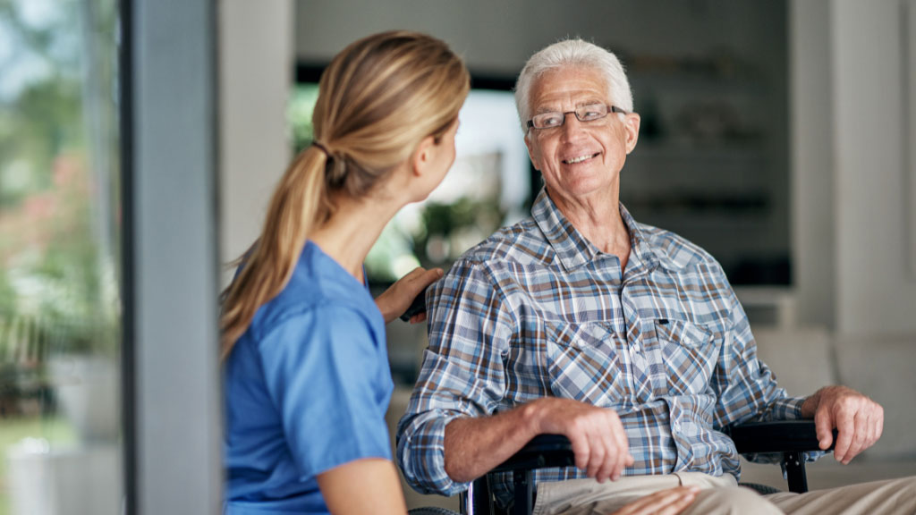 Elderly man with caregiver