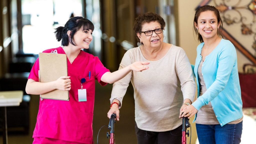 Assisted living staff member with family