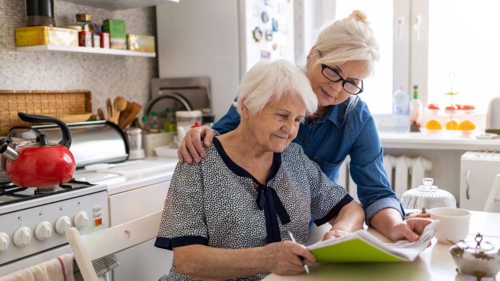 Mother & daughter looking at paperwork