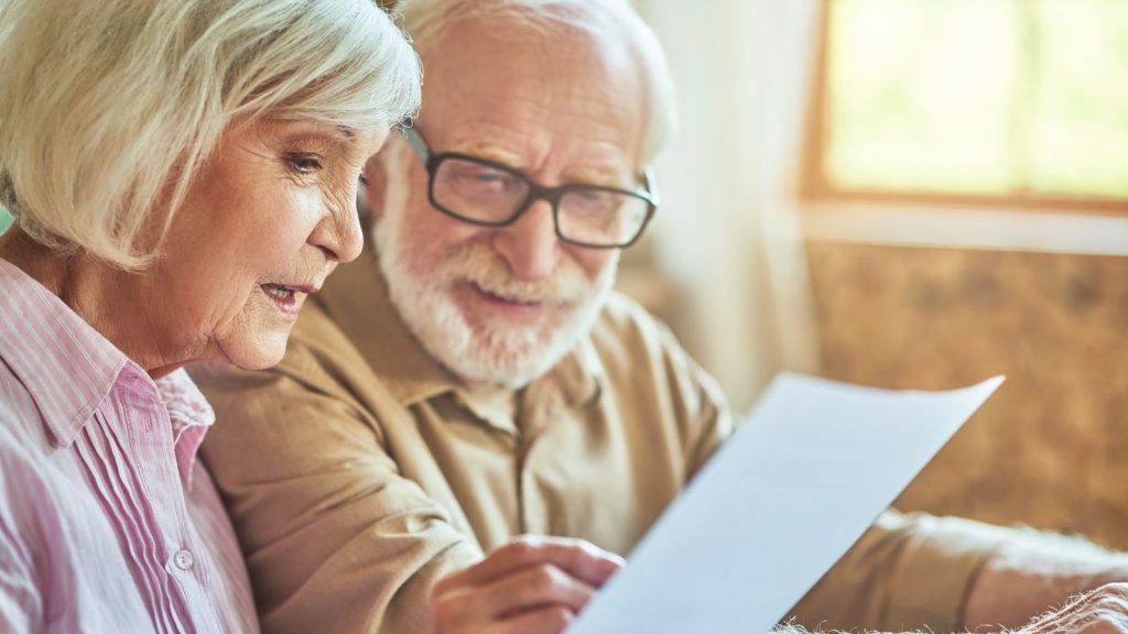 Senior couple reviewing paperwork
