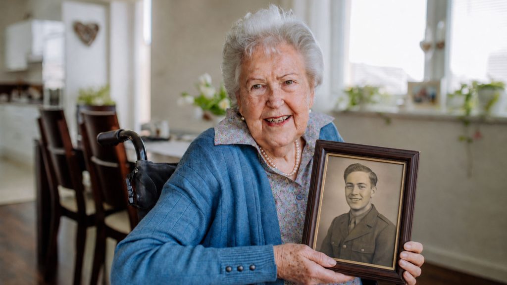 Widow holding husbands WWII photo