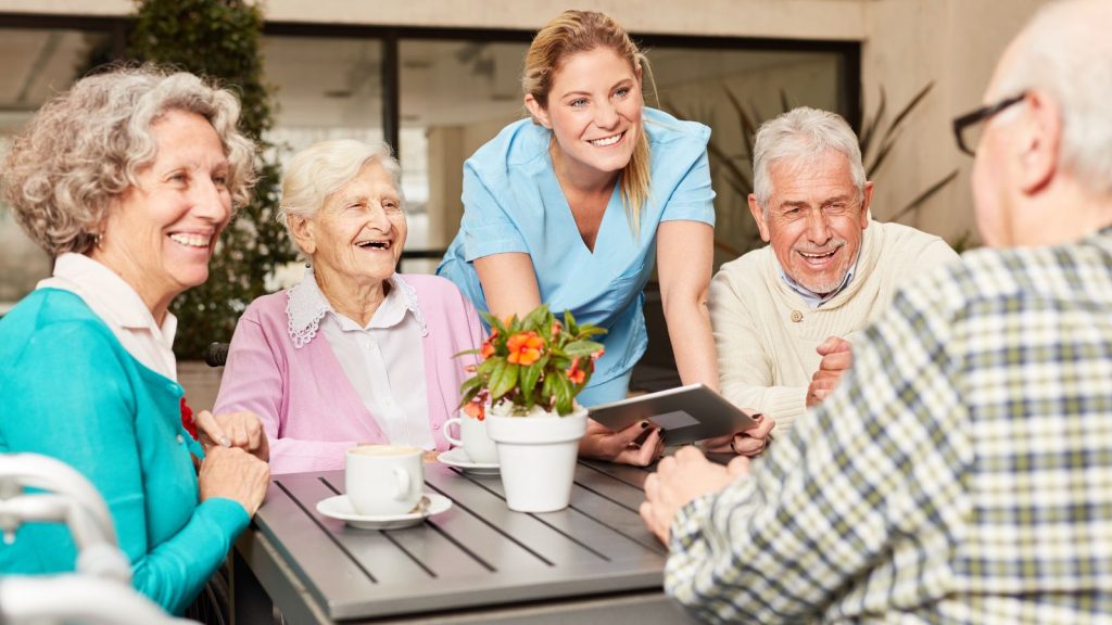 Group of seniors with caregiver