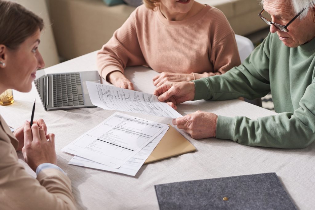 Senior family reviewing Social Security income and medical care expenses